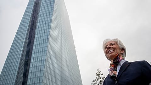 President of European Central Bank Christine Lagarde talks to media people in front of the ECB building before she takes office in Frankfurt, Germany in 2019