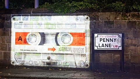 A mysterious cassette tape is being projected onto several "Beatles locations"