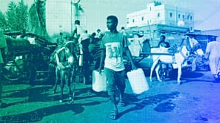 People gather to collect water in Khartoum, May 2023