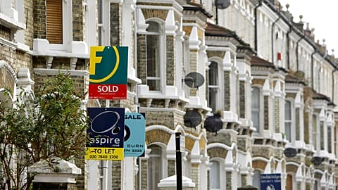 Estate agents' boards are seen in south London, Tuesday Feb. 17, 2009. British homeowners are returning to the property market looking to pick up bargains following recent hou