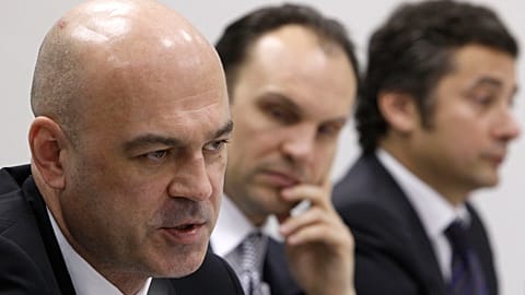 Alexey Kuzmichev (left), chairman of the advisory committee of Russian investment company A1, attends a news conference in Moscow, in 2013.