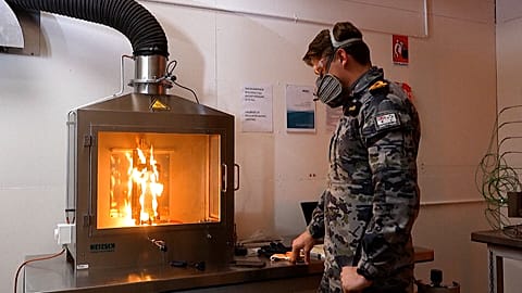 Image show a student at the University of New South Wales' new fire laboratory where researchers are developing more fire-resistant materials. 