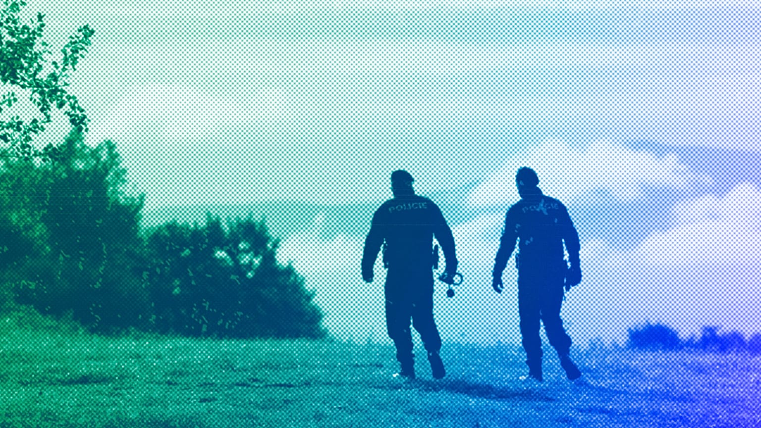 Czech policemen walk on patrol at the border with Slovakia near Stary Hrozenkov, September 2022