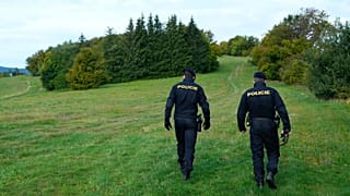 Czech policemen walk on patrol at the border with Slovakia near Stary Hrozenkov, Czech Republic, on Sept. 29, 2022.