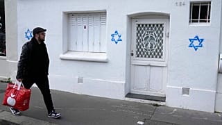 Stars of David tagged on a wall in Paris
