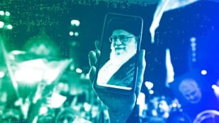 An Iranian demonstrator shows a photos of the Supreme Leader Ayatollah Ali Khamenei on the screen of her cellphone in Tehran, October 2023