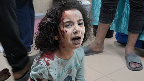 Palestinian child wounded in Israeli bombardment is brought to a hospital in Deir al Balah, south of the Gaza Strip, Thursday, Nov. 2, 2023.