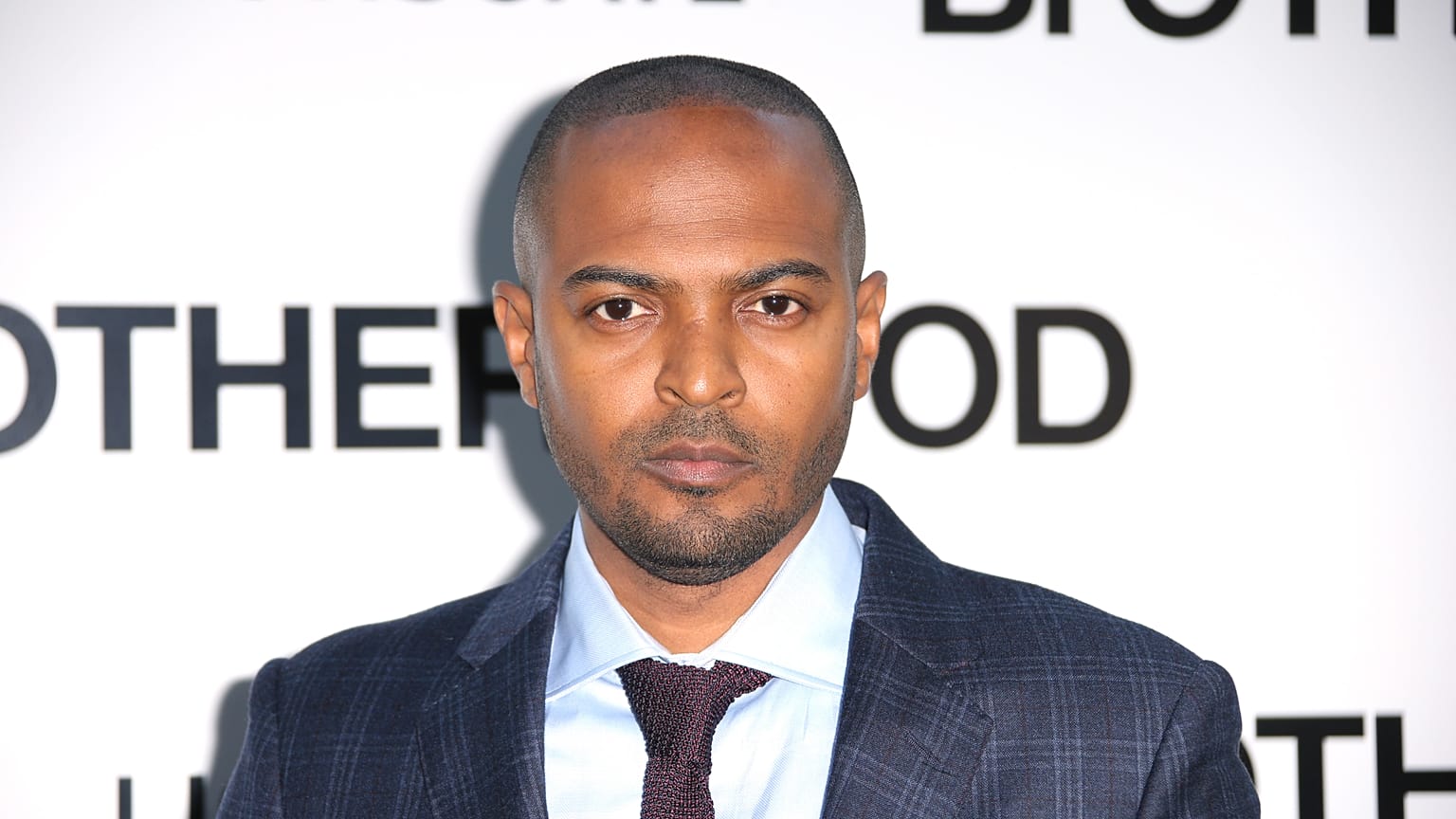 Actor and director Noel Clarke poses for photographers upon arrival at the premiere of the film 'Brotherhood' in London