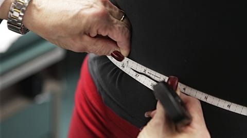 A waist being measured.