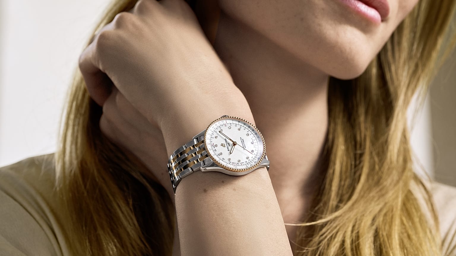 Model wears Breitling Navitimer Automatic 36