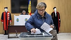A woman casts her vote during local elections in Chisinau, Moldova on Sunday