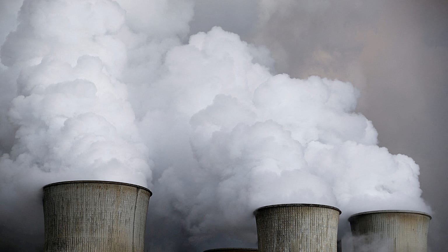 Steam rises from the cooling towers of the coal power plant of RWE, one of Europe's biggest electricity and gas companies in Niederaussem, Germany.