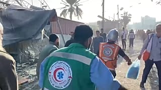 Palestinian first responders carry injured in Khan Younes