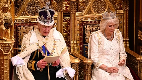 Britain's King Charles III delivers his speech as Queen Camilla sits next to him during the State Opening of Parliament at the Houses of Parliament, in London, Tuesday, Nov. 7