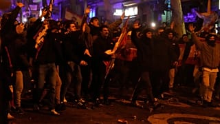 Protesters confront the police during a protest by right wing demonstrators near the national headquarters of Spain's Socialist Party in Madrid, Spain, Tuesday, Nov. 7, 2023