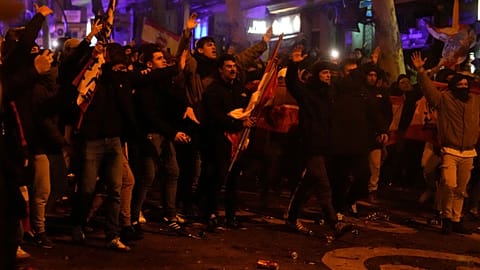 Protesters confront the police during a protest by right wing demonstrators near the national headquarters of Spain's Socialist Party in Madrid, Spain, Tuesday, Nov. 7, 2023