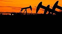Oil Pump jacks work at dusk near Barnes City, Texas, Wednesday, 1 November 2023. 