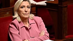 Marine Le Pen listens during a session on the situation in the Middle East at the French National Assembly in Paris on 23 October