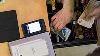 Apple iPhone with cash register