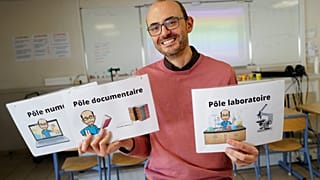 Nicolas Gaube (C), Life and Earth science (SVT) teacher, poses in his class at The Rene Cassin middle school in Agde, southern France, on November 6, 2023.