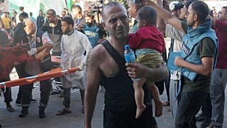 Palestinians wounded in the Israeli bombardment of the Gaza Strip are brought to a treatment room of al Aqsa Hospital on Deir al Balah, Gaza Strip, Friday, Nov. 10, 2023. 