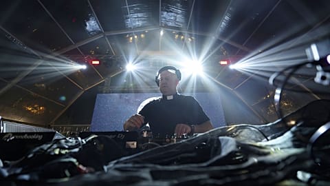 Roman Catholic priest Guilherme Peixoto plays a set, together with the Portuguese Army Symphonic Band, during Army Day celebrations in Viana do Castelo, northern Portugal