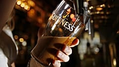 Pinte of Guinness beer being poured.