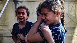  Children react during the funeral of the Faojo family, killed in Israeli bombing on Rafah in the southern Gaza Strip