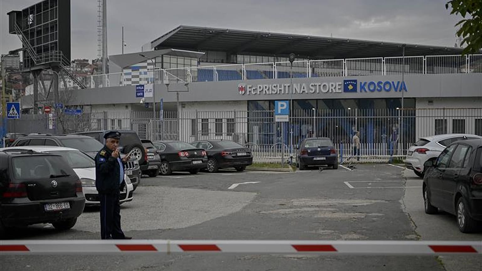 Kosovo police officer stands guard near the Fadil Vokrri stadium, in Pristina on November 10, 2023