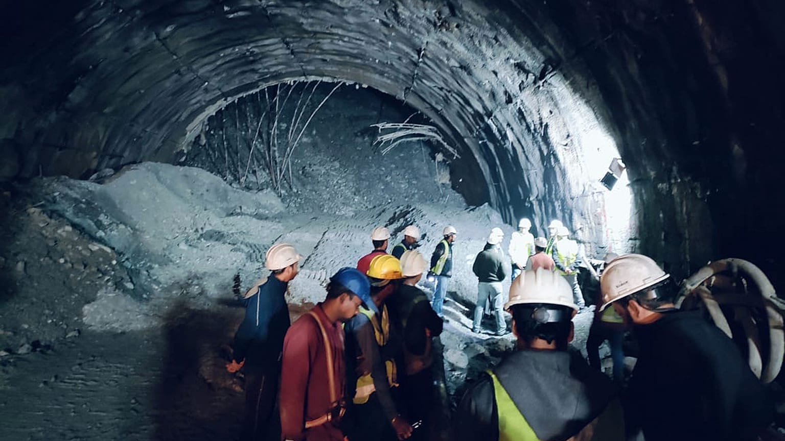 Rescuers inside a collapsed road tunnel where more than 30 workers were trapped by a landslide in northern in Uttarakhand state, India