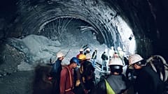 Rescuers inside a collapsed road tunnel where more than 30 workers were trapped by a landslide in northern in Uttarakhand state, India