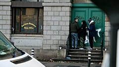 People gather near MQI addiction and homelessness charity in Dublin, Ireland, 10 November 2023