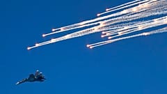 FILE - A Russian fighter jet flies during a rehearsal of the Russian Navy Day parade in Sevastopol, Crimea, Friday, July 24, 2015.