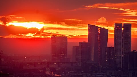 The European Central Bank , 2nd right, is pictured during sunrise in Frankfurt, Germany, Thursday, Oct. 26, 2023.