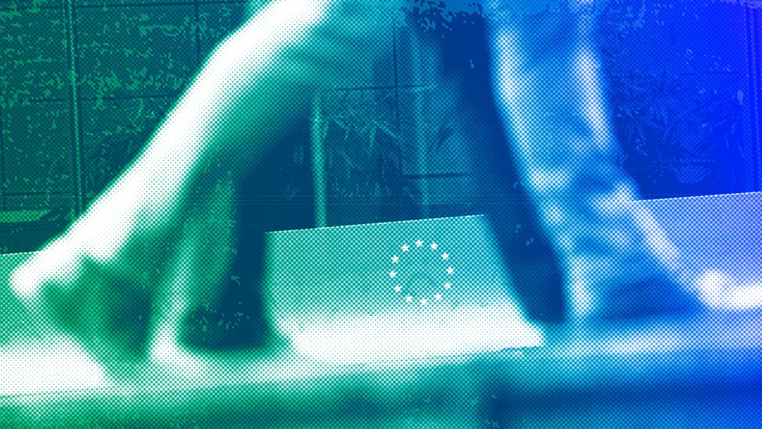 People walk past a European Union logo in a security fence at the European quarter in Brussels, October 2019