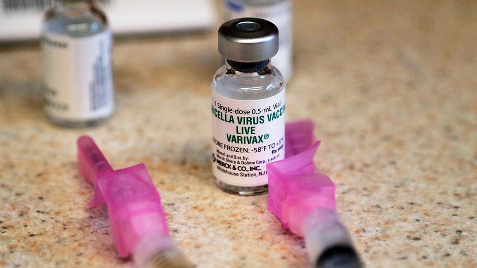 A chickenpox (also known as varicella) vaccine sits next to syringes and ready for a student at a free immunization clinic at a Seattle public school on Dec. 30, 2019, Seattle