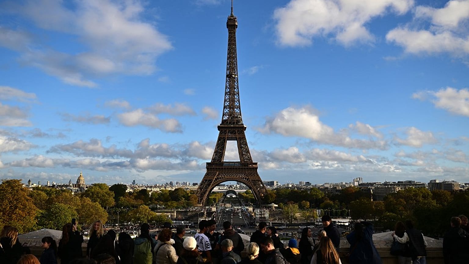 Tourists near the Eiffel Tower, Paris, November 2023.