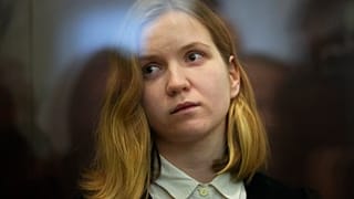 Suspect Darya Trepova stands in a glass cage as she attends a court hearing in the 1st Western District Military Court, in St. Petersburg, Russia on Wednesday