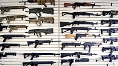FILE - In this photo taken Oct. 2, 2018, semi-automatic rifles fill a wall at a gun shop in Lynnwood in the United States.