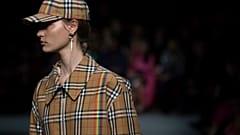 A model wears a creation by designer Burberry at the Autumn/Winter 2018 fashion week runway show in London, in February 2018.