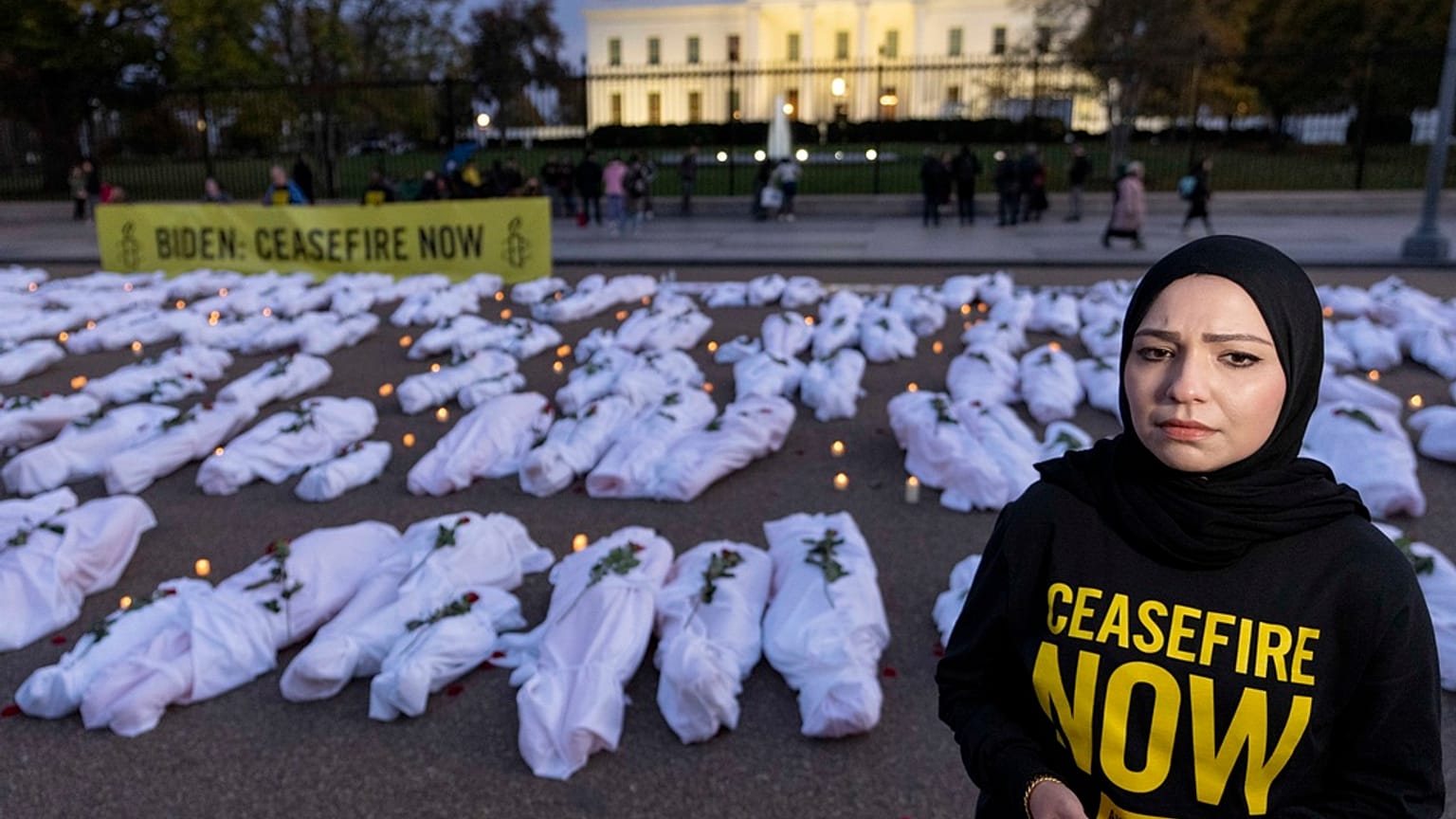 Fake white body bags, representing those killed in the escalating conflict in Gaza and Israel, in front of the White House