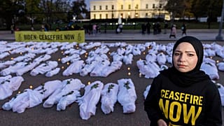 Fake white body bags, representing those killed in the escalating conflict in Gaza and Israel, in front of the White House