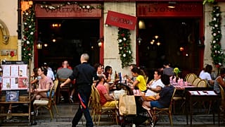 Clients eat at a Bouchon, a traditional Lyon restaurant, on July 28, 2023.