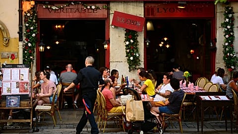 Clients eat at a Bouchon, a traditional Lyon restaurant, on July 28, 2023.