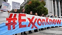 Climate activists protest on the first day of the Exxon Mobil trial outside the New York State Supreme Court building on October 22, 2019 in New York City.