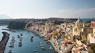 For a significantly more affordable holiday that’s a bit more down to earth, head to the island of Procida off the coast of Naples.