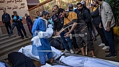 Palestinians mourn their relatives killed in the Israeli bombardment of the Gaza Strip, in the hospital in Khan Younis, Saturday, Nov. 18, 2023.