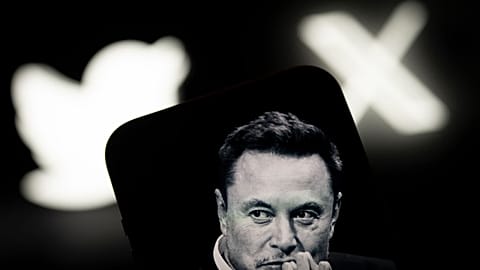 An image of Elon Musk is seen displayed on a mobile device with the Twitter and X logos in this illustration photo 