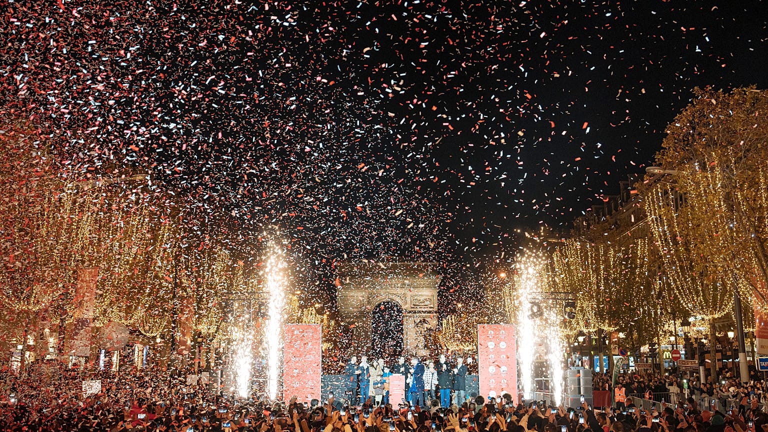French actor Gilles Lellouche, center right, Paris mayor Anne Hidalgo, center left, and guests during the inauguration of the Champs Elysee Avenue illumination.