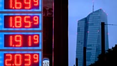 Gas prices are displayed at a gas station next to the headquarters of the European Central Bank, rear, in Frankfurt, Germany, on July 28, 2023.